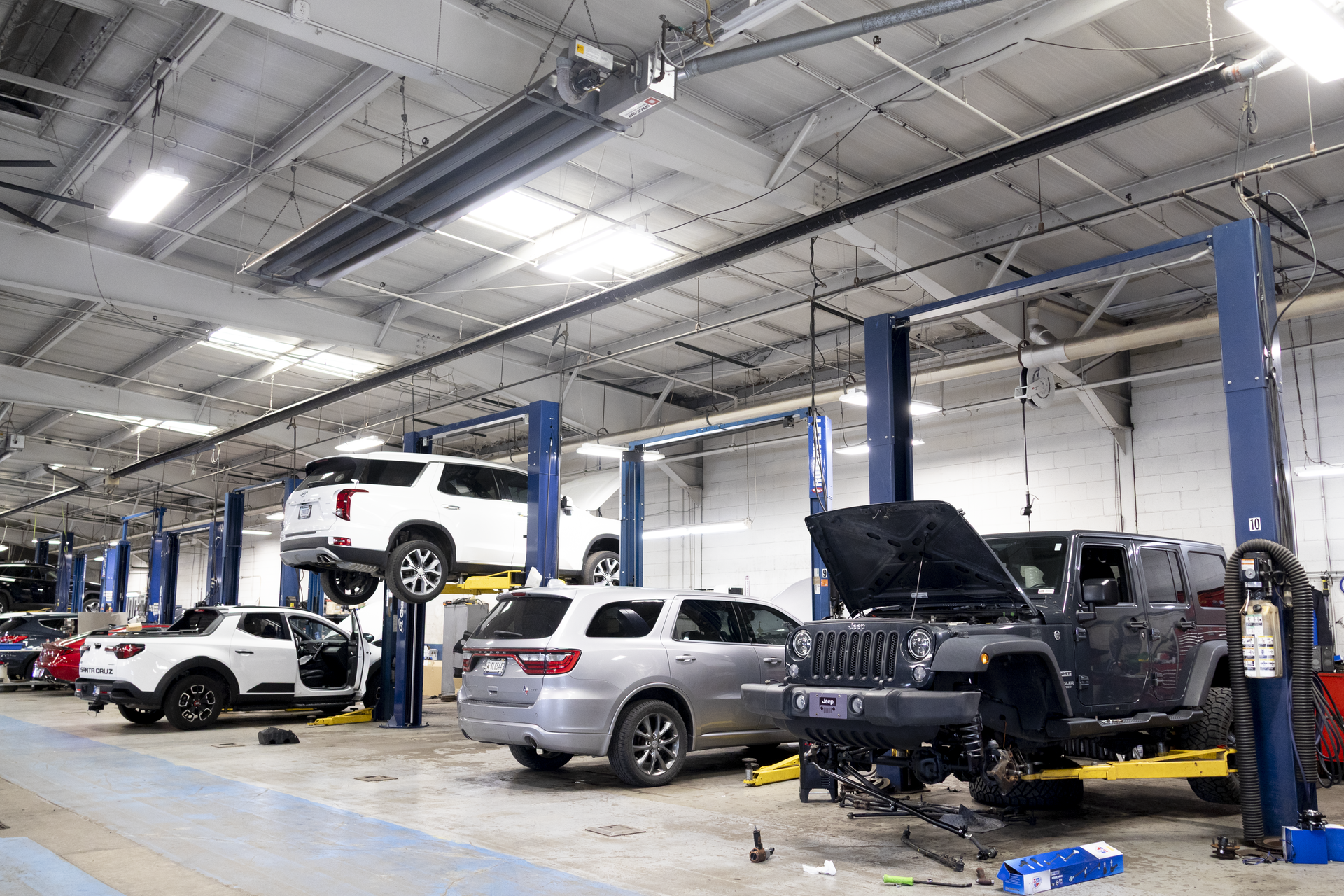 Collision repair technician in paint booth