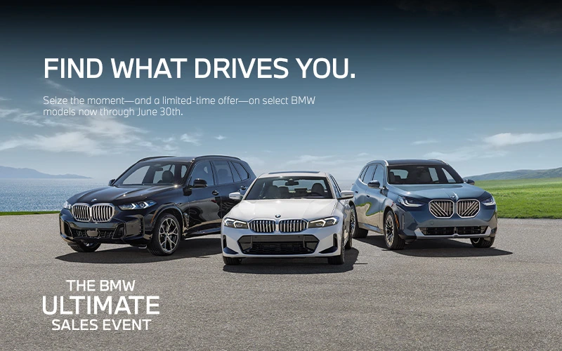 BMW X5, 330i, and X3 parked near seaside
