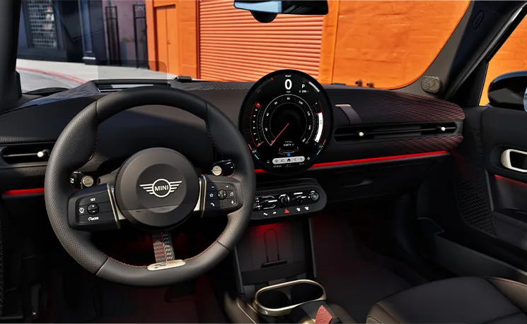 Interior of 2026 Cooper S 4 Door showing steering wheel, dashboard, and infotainment display.