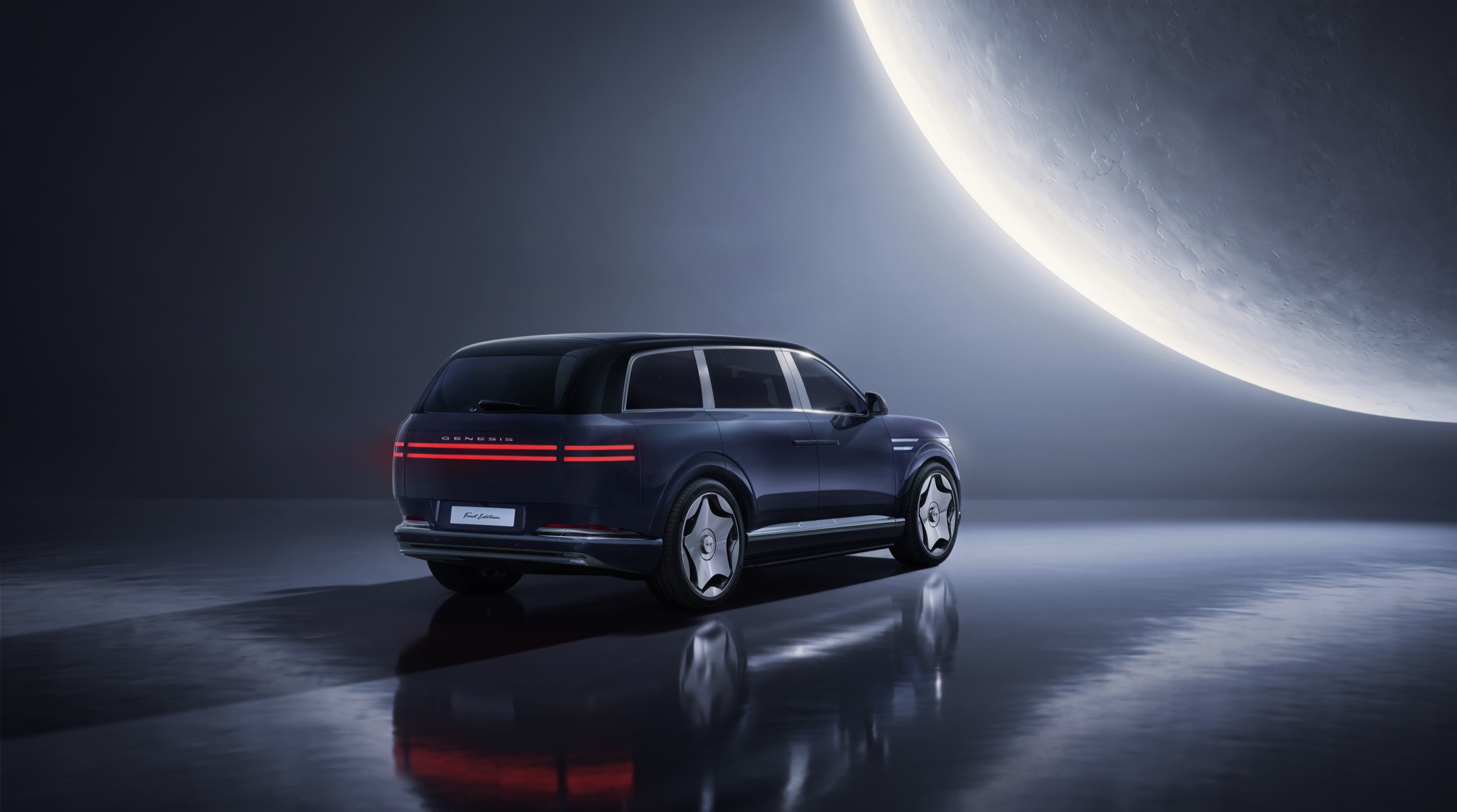 Dark blue GV90 Neolun from the rear three-quarter under a large moon