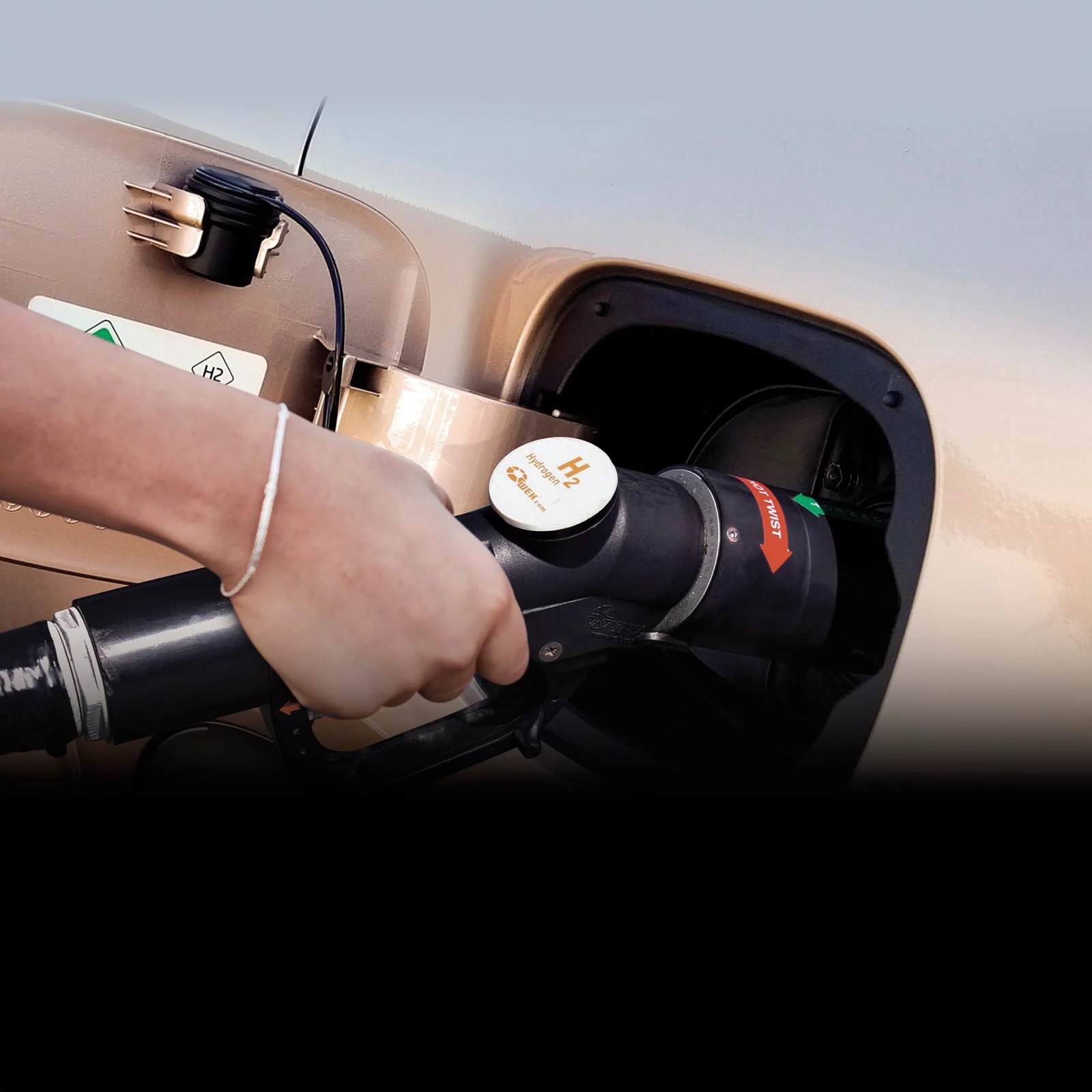 Hydrogen nozzle being inserted into a Hyundai NEXO fueling port