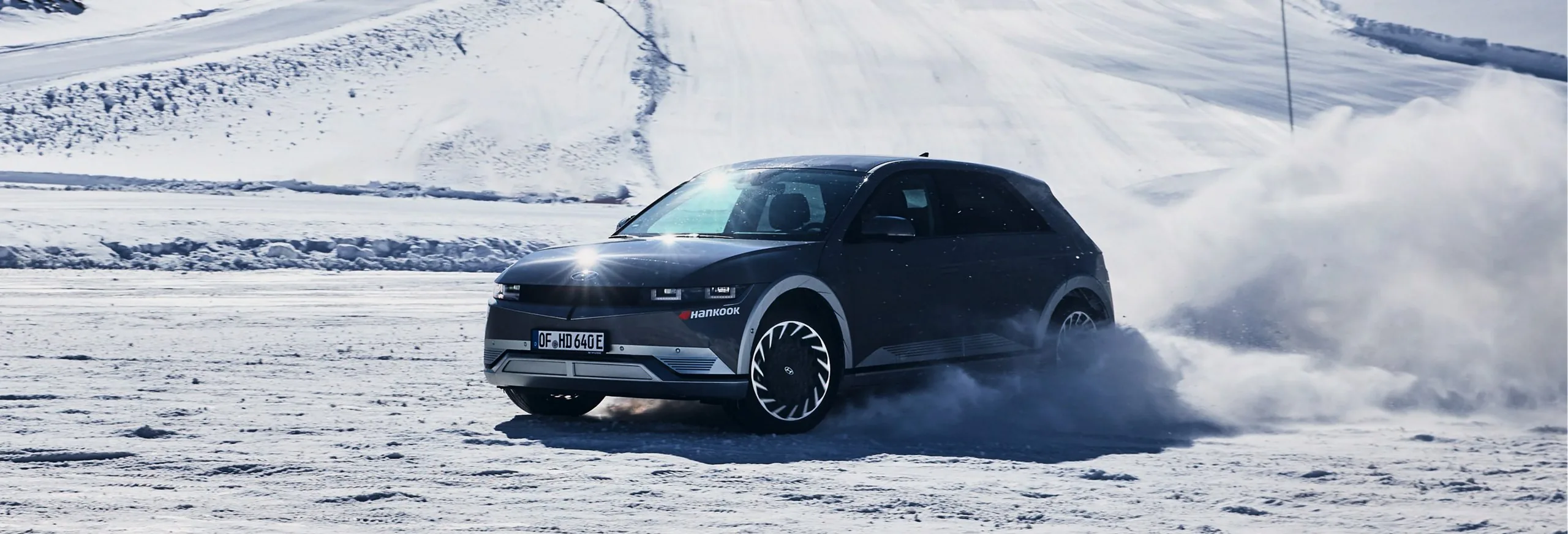Hyundai IONIQ 5 driving through deep snow
