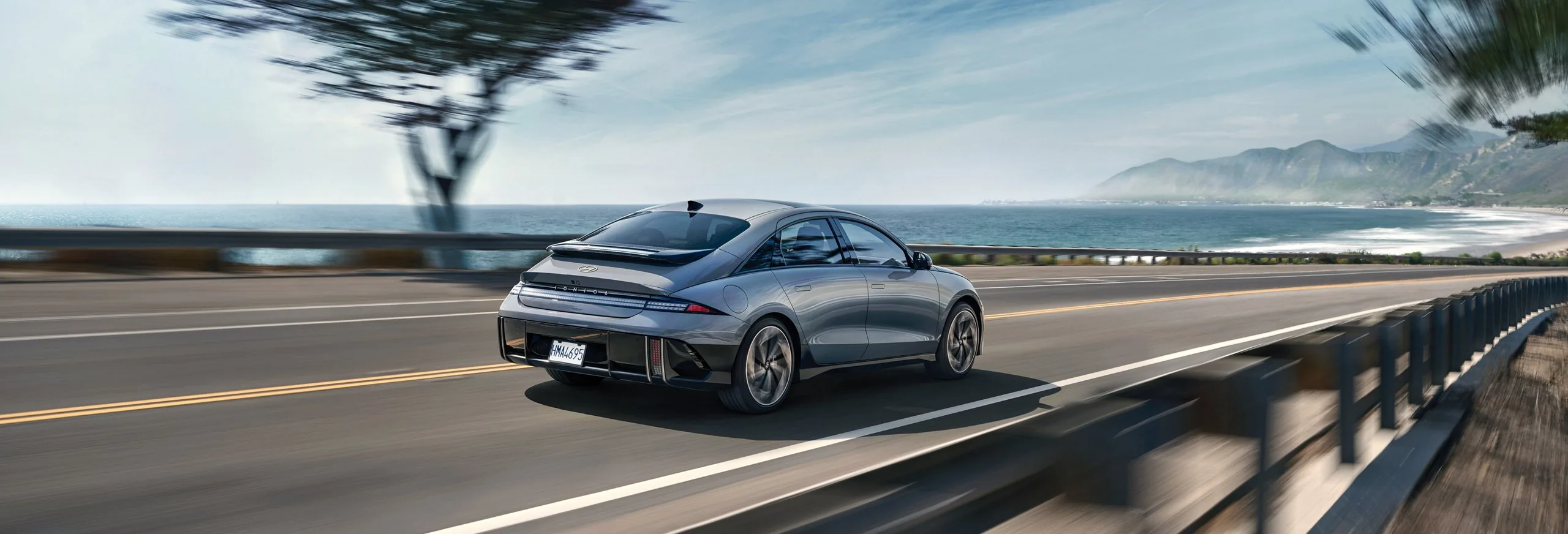 Hyundai IONIQ 6 driving on a coastal highway
