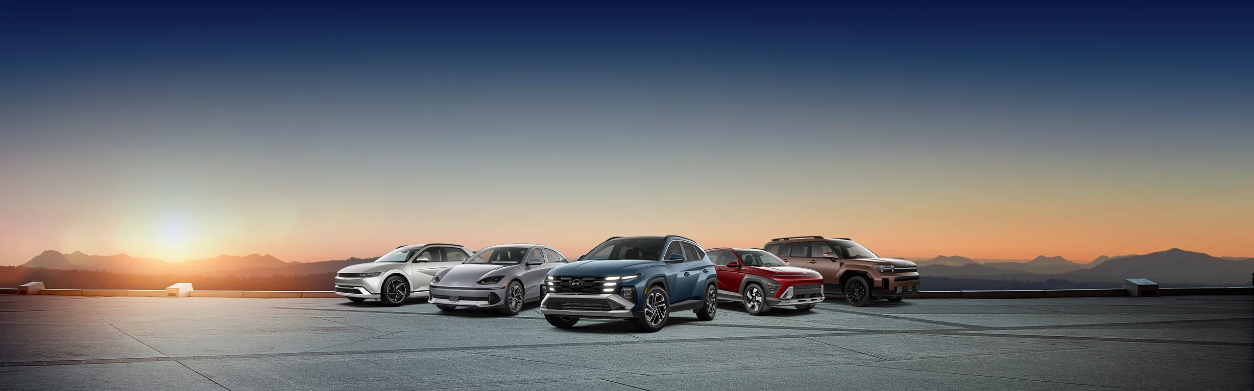 Hyundai IONIQ 6, Tucson, and Santa Fe lined up on a white studio background