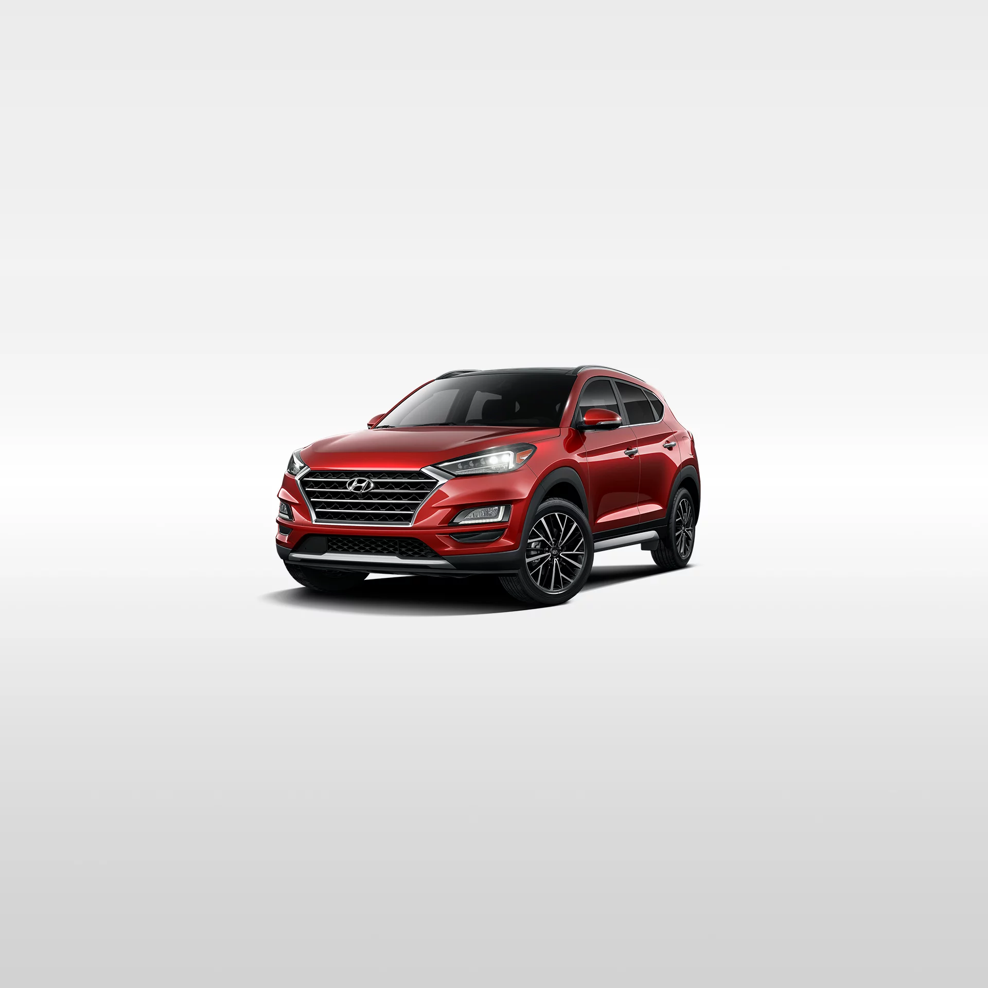 Red Hyundai Tucson studio photo