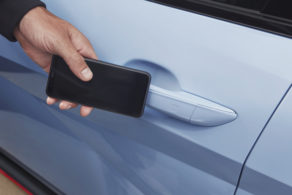 Driver using a smartphone near a vehicle door