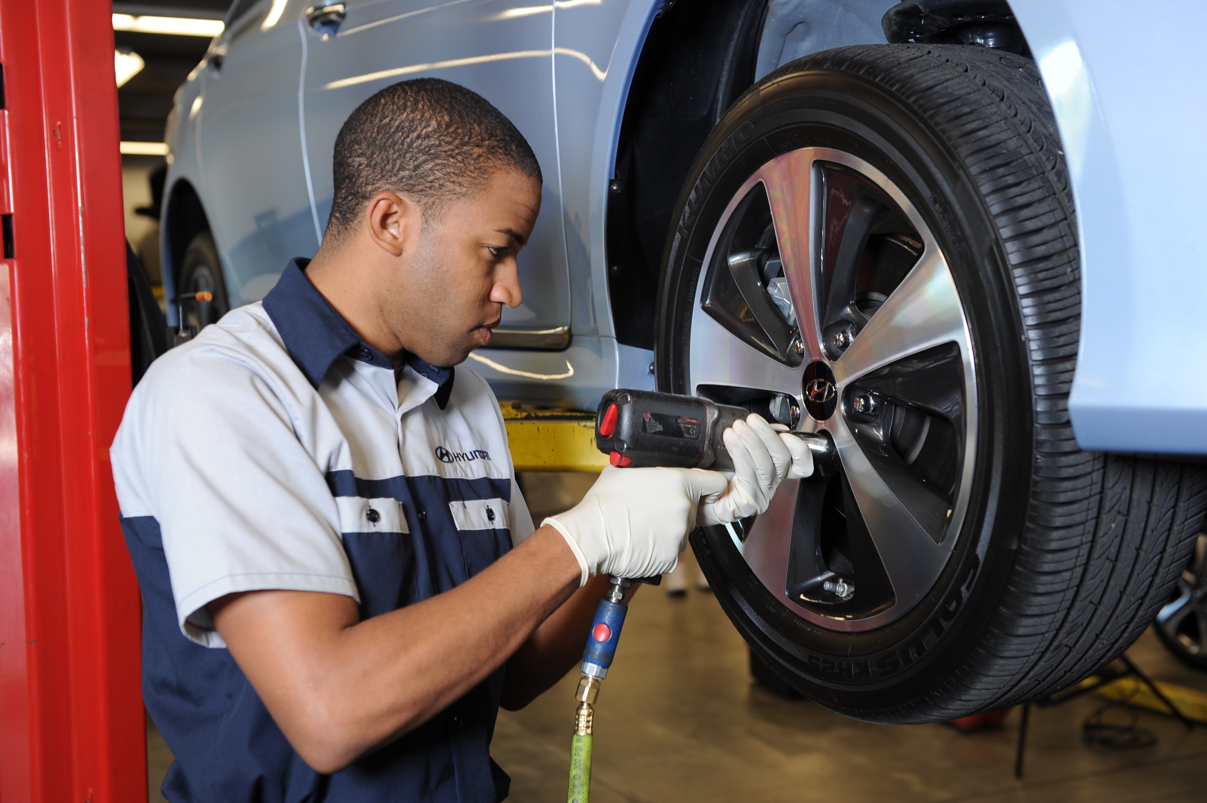 Hyundai service technician working on a vehicle