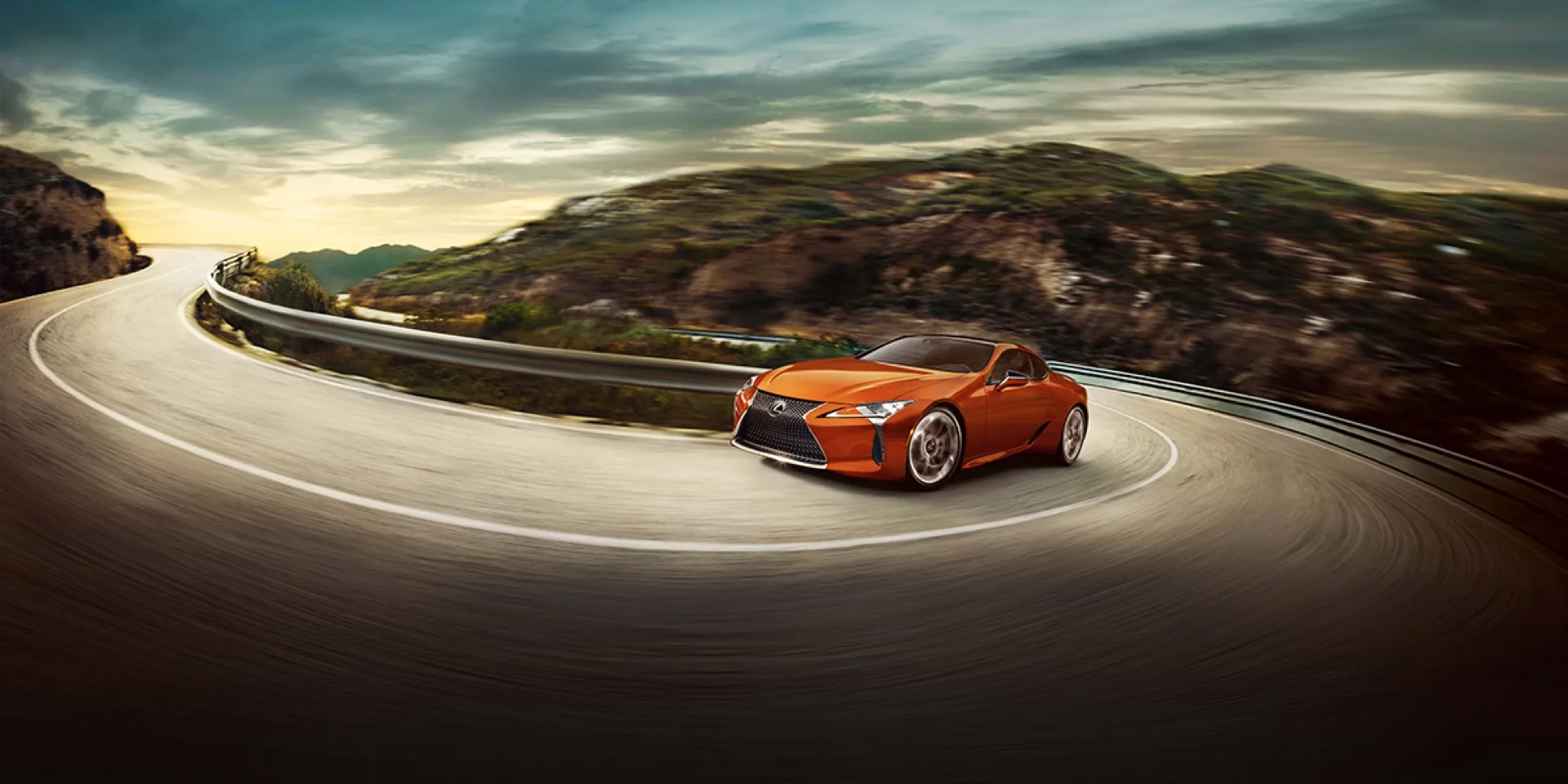 Lexus LC 500 driving a mountain curve at speed