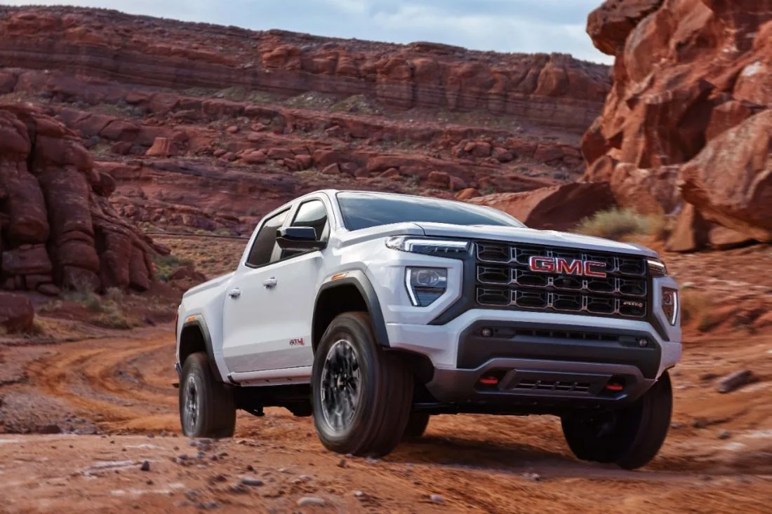 Front three-quarter view of a 2026 GMC Canyon AT4 in Summit White