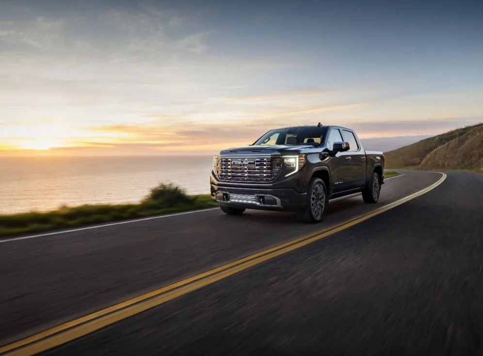 Front three-quarter view of a 2026 GMC Sierra Denali Ultimate 1500 in Titanium Rush Metallic