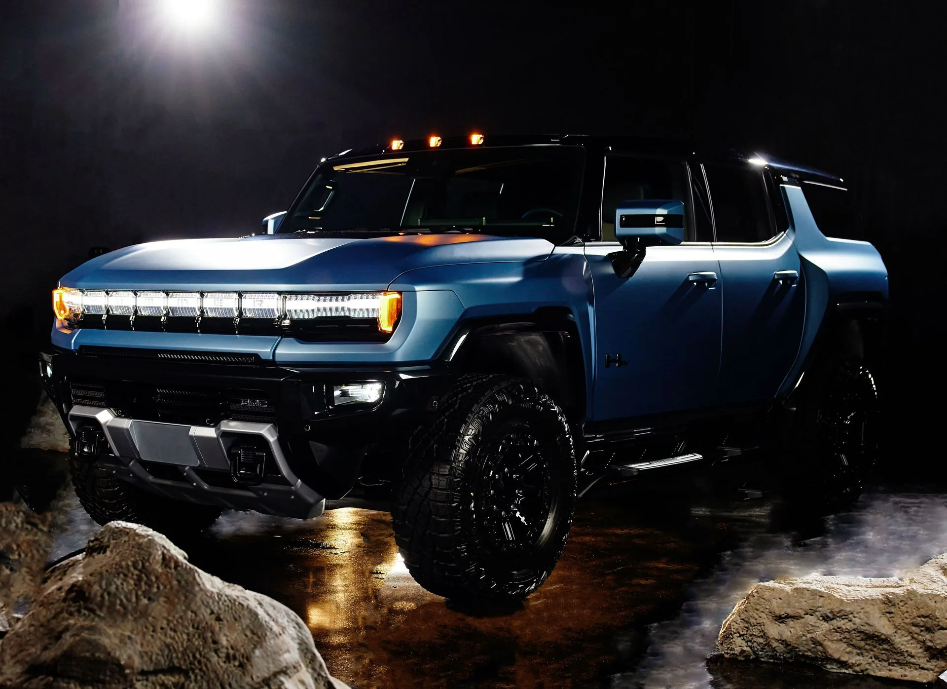 Limited-edition 2024 GMC HUMMER EV 3X Omega Edition in Neptune Blue Matte parked outdoors